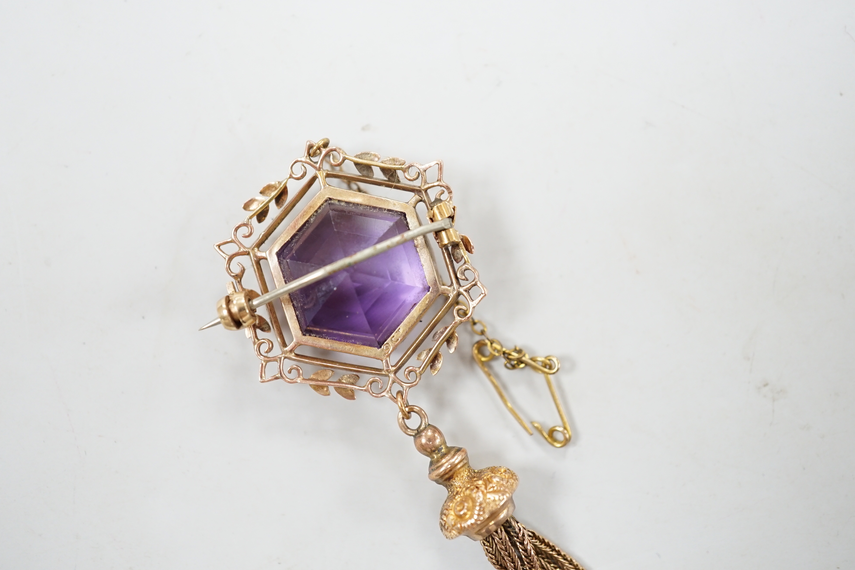 An Edwardian 9ct and hexagonal cut amethyst set tassel drop brooch, overall 75mm, gross weight 10.7 grams.